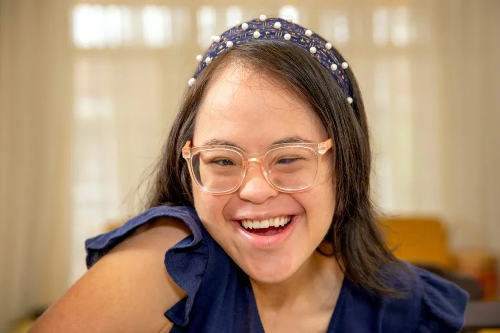 Disabled girl smiling at camera
