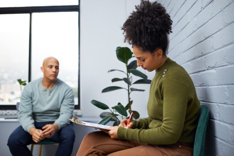 Woman with clipboard writing down notes