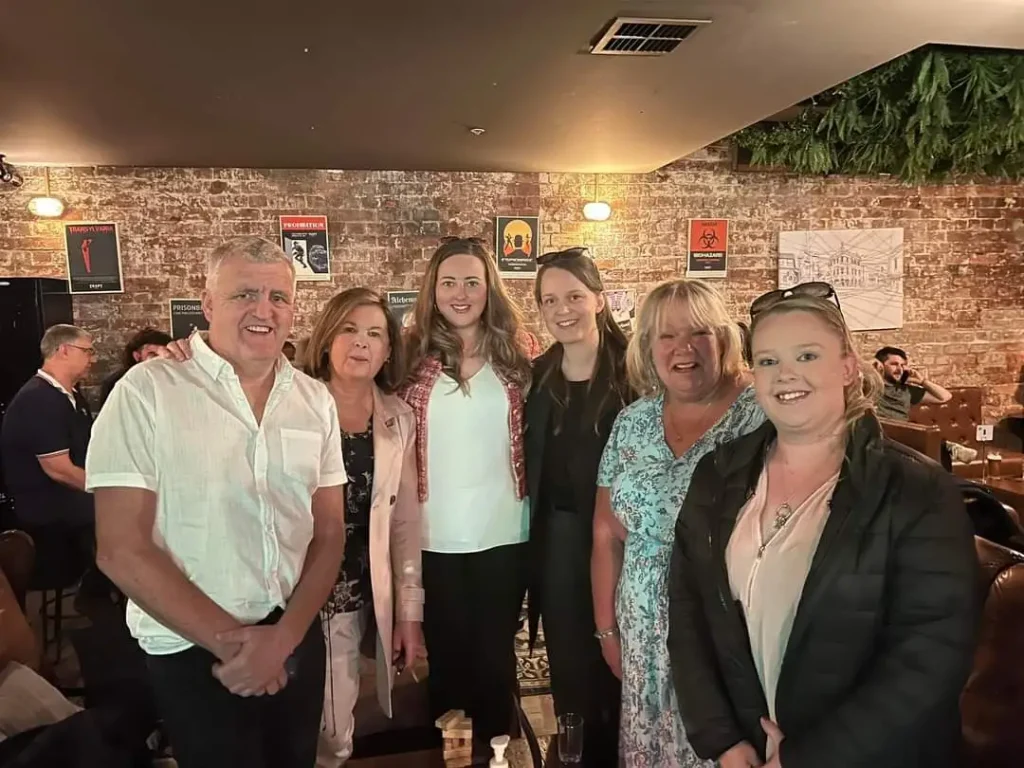 Portrait of founder with family and friends